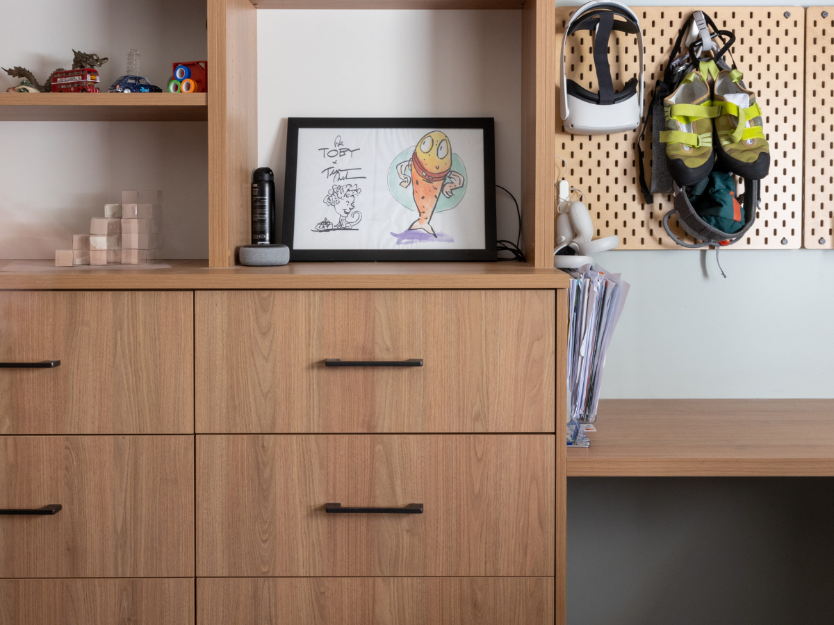 hallway-study-nook-corridor-workspace.jpg Modern hallway study nook featuring a built-in floating desk, shelving, and task lighting in a small corridor space.